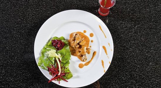 Beef Stroganoff with beet and strawberry side dish